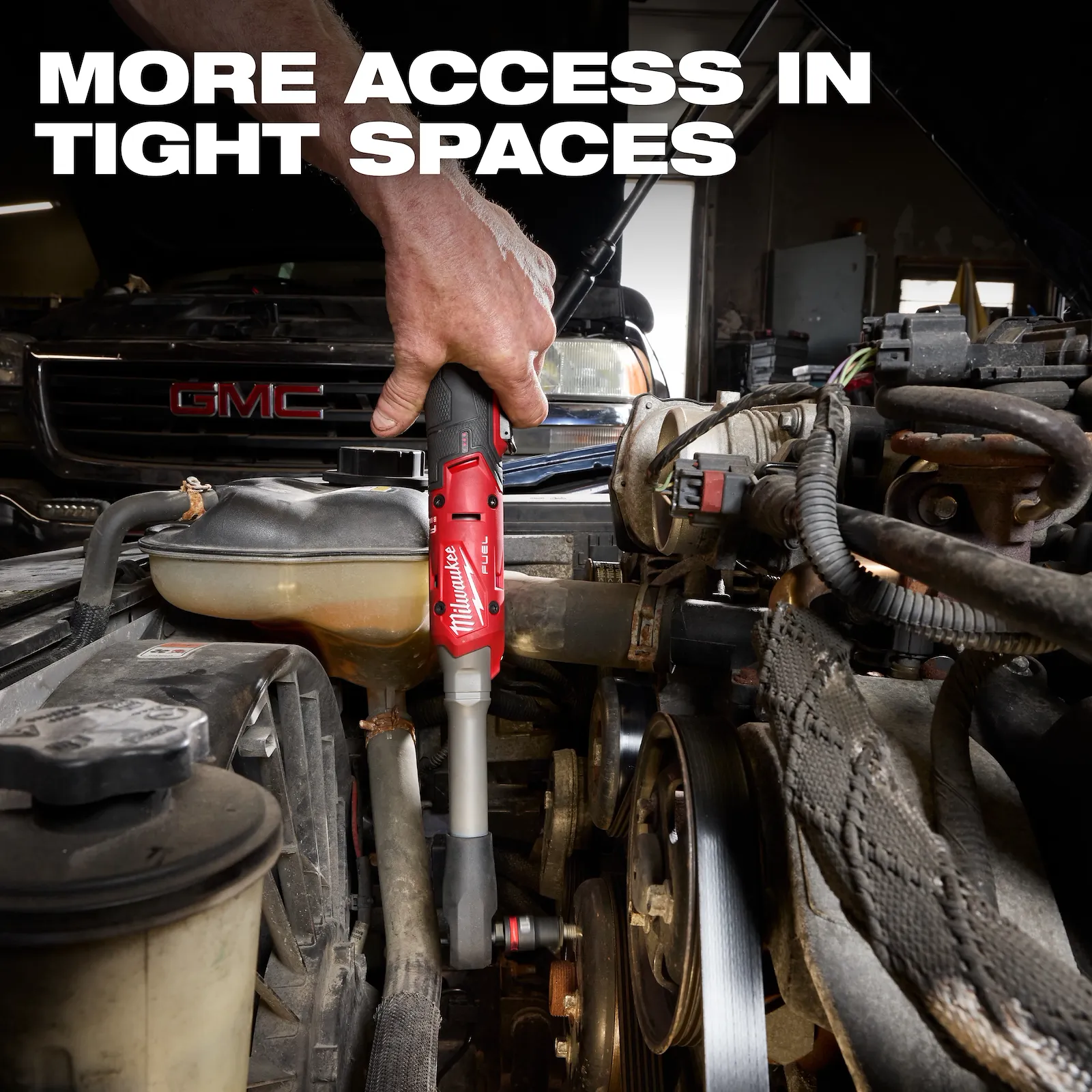 Milwaukee M12 FUEL 3055-20 extended-reach ratchet being used in a tight engine bay
