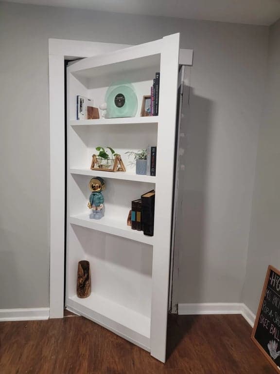 Hidden bookcase door opening path used to plan the pivot hinge clearance