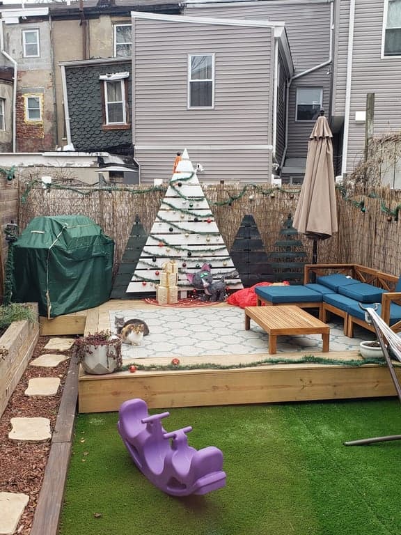 Platform deck construction in progress on concrete patio