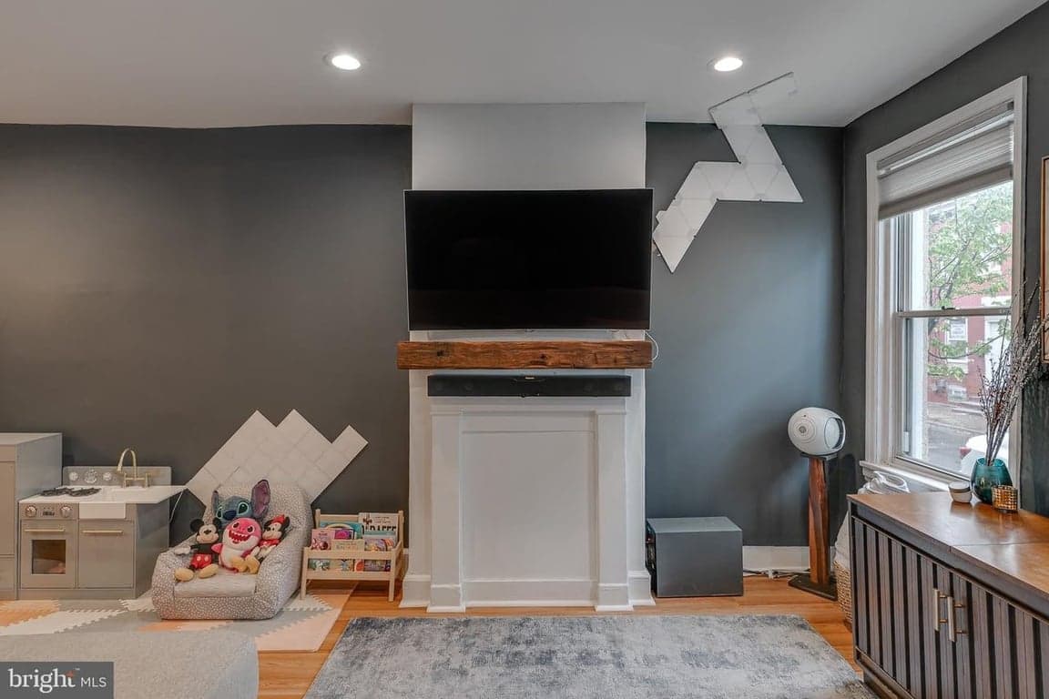 Barn beam mantel above fireplace