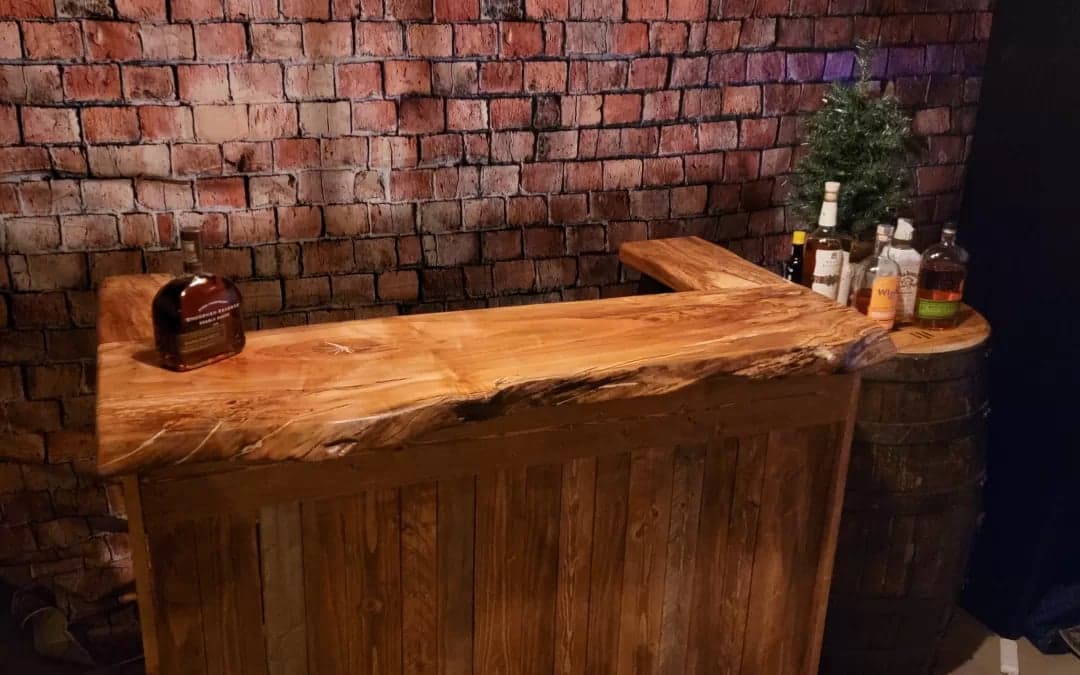 Completed spalted maple bar with dark wood base in the finished basement