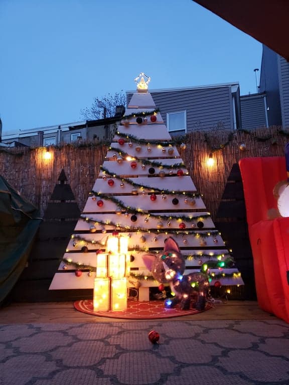 Decorated outdoor wooden Christmas tree