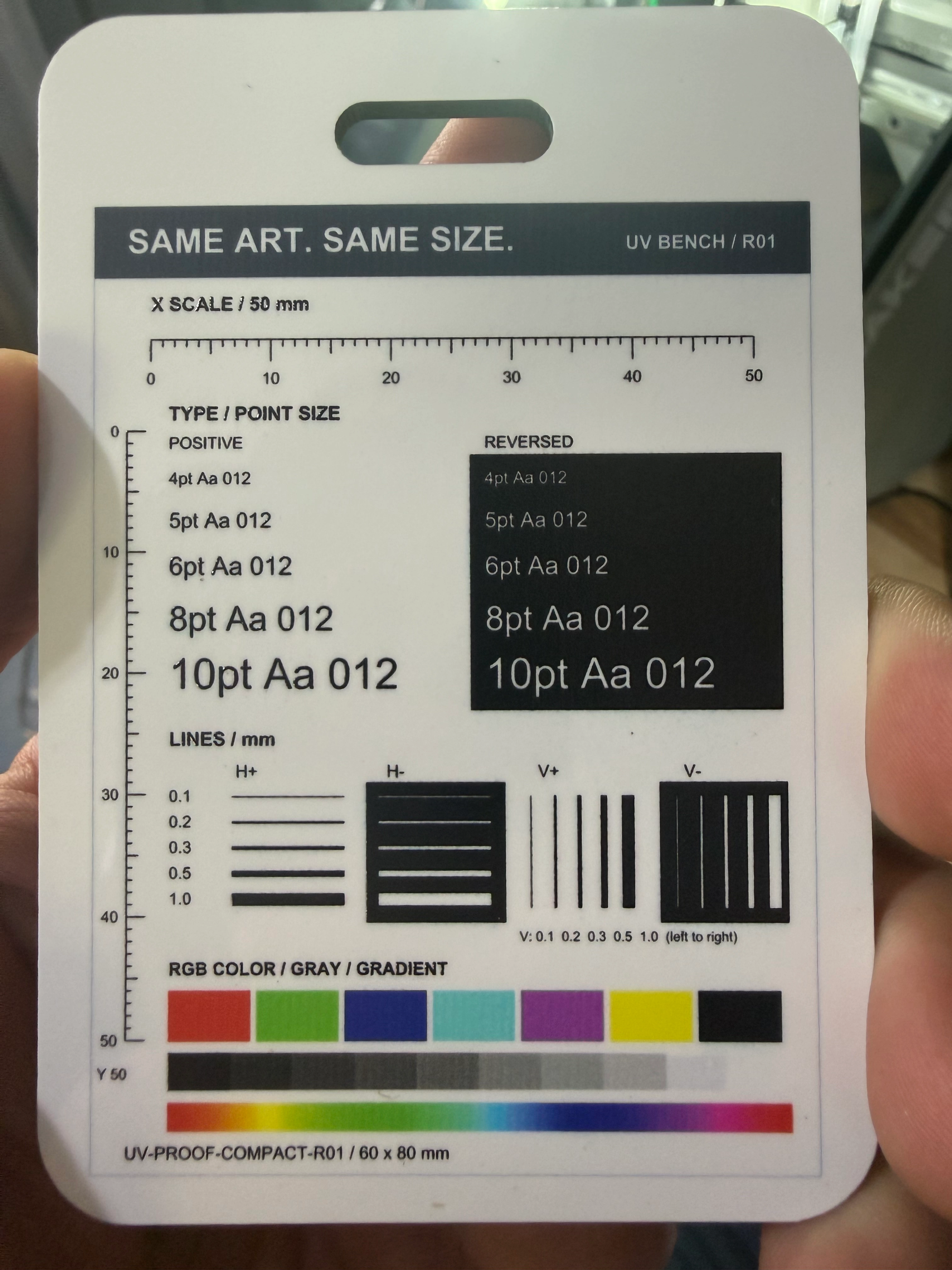 eufyMake E1 luggage-tag print from our same-day, same-shop Omni comparison, showing matching fine text, line patterns and color bars.